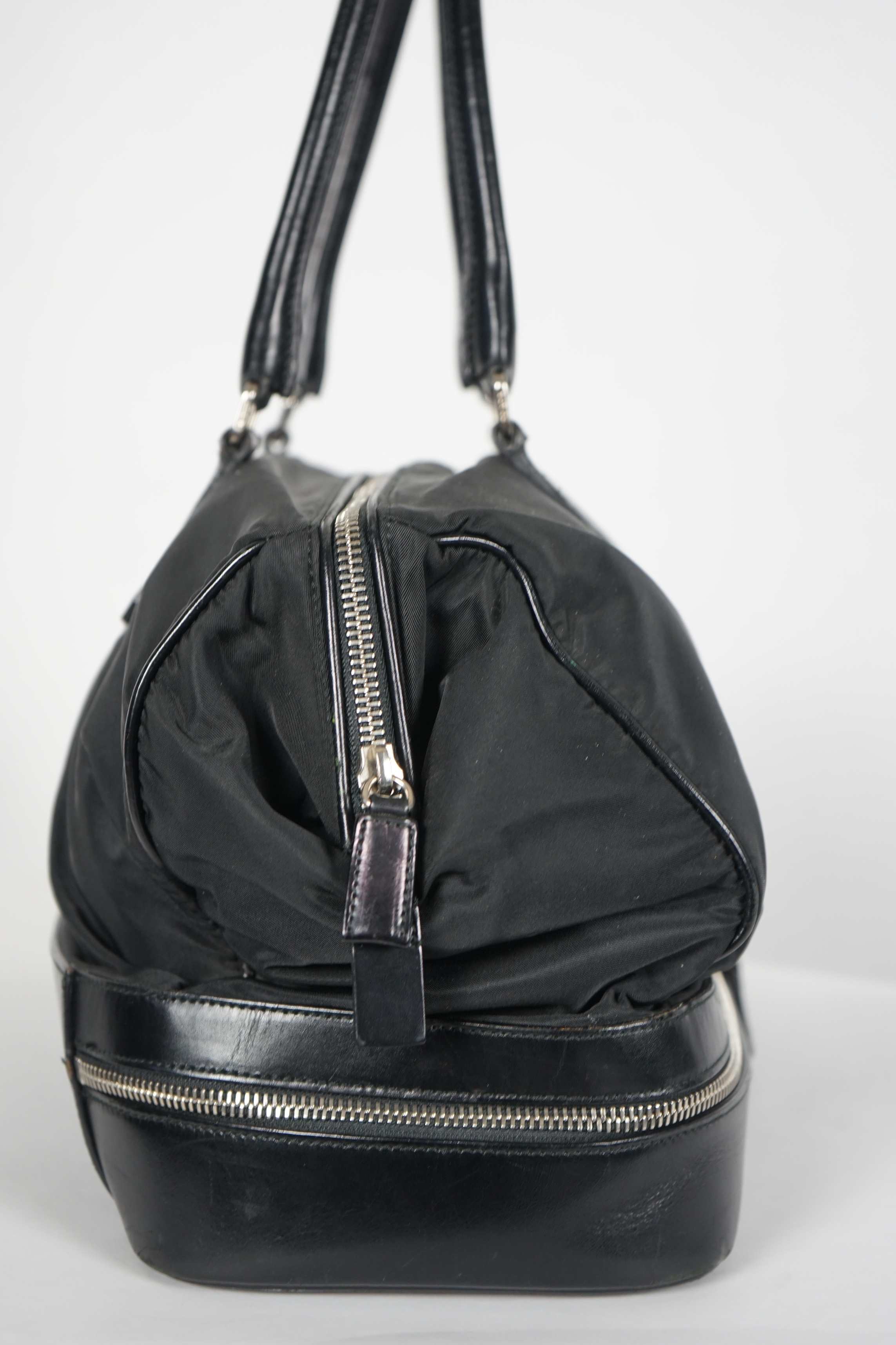 A Prada Tessuto black nylon and leather bag, width 38cm, height 23cm, depth 50cm